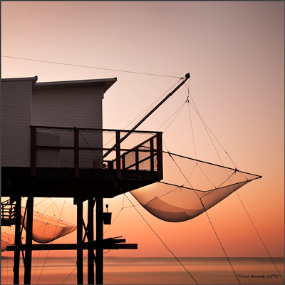 Fishing huts at sunrise. Photograph by Tricia Kennedy. Fishing huts at sunrise. Photograph by Tricia Kennedy.