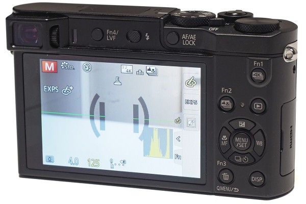 The TZ100 has a small corner-mounted EVF, and the LCD is touch sensitive