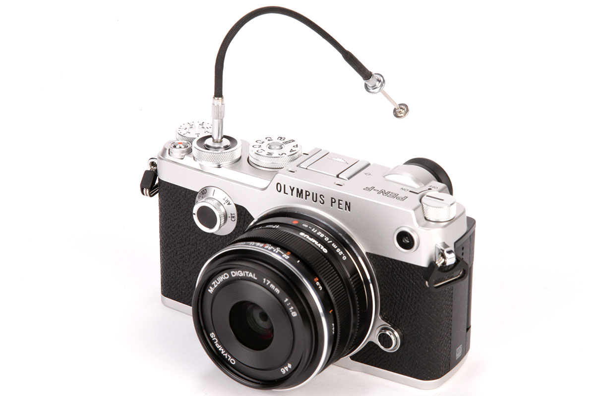 A mechanical cable release can be screwed in to the shutter button